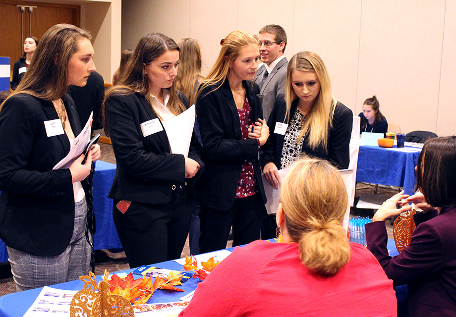 Alumni job seekers at a career fair