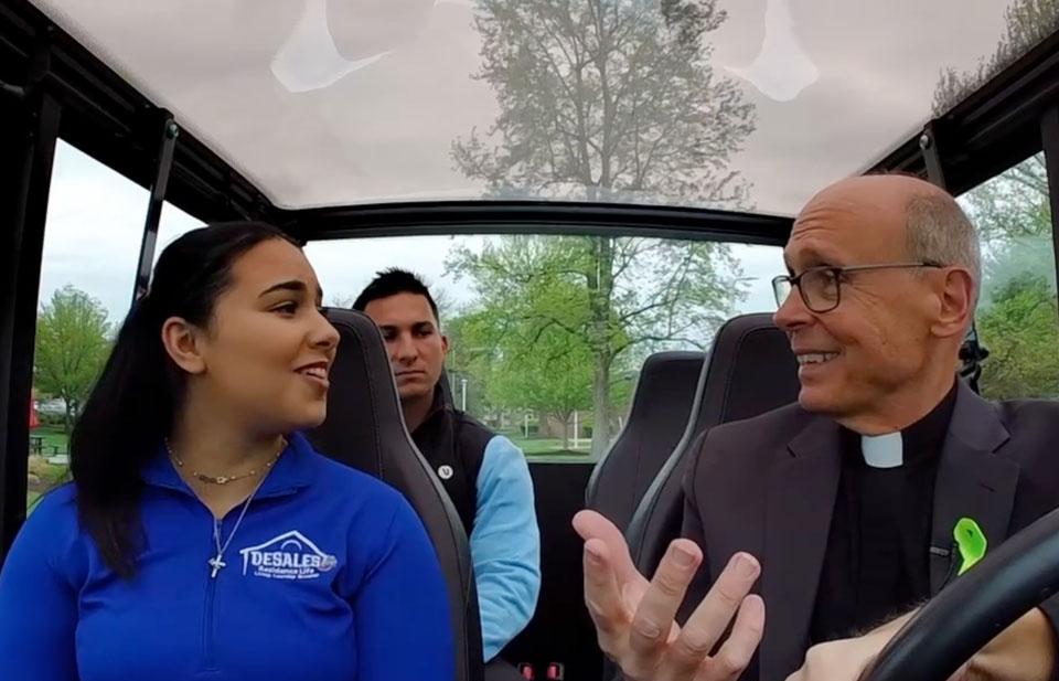 Joyce Hanna, Justin DeStaso, and Fr Jim riding in the buggy