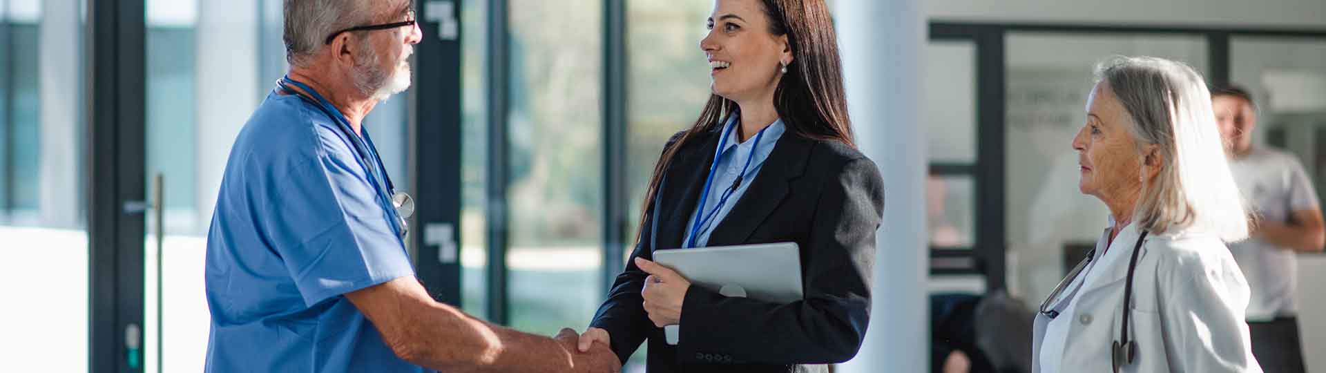doctors meeting in a hallway