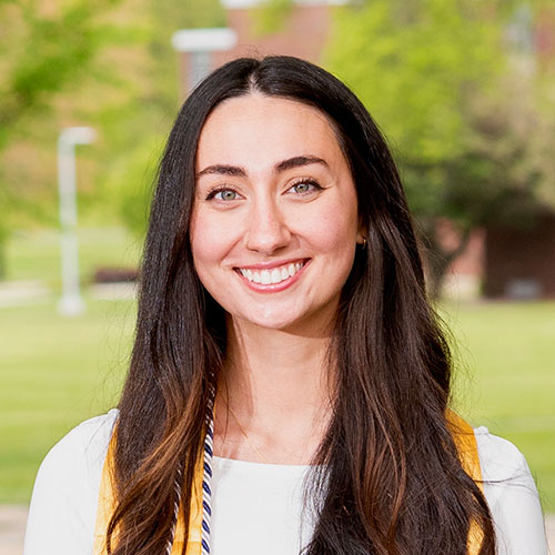 Emma Coccio standing on campus