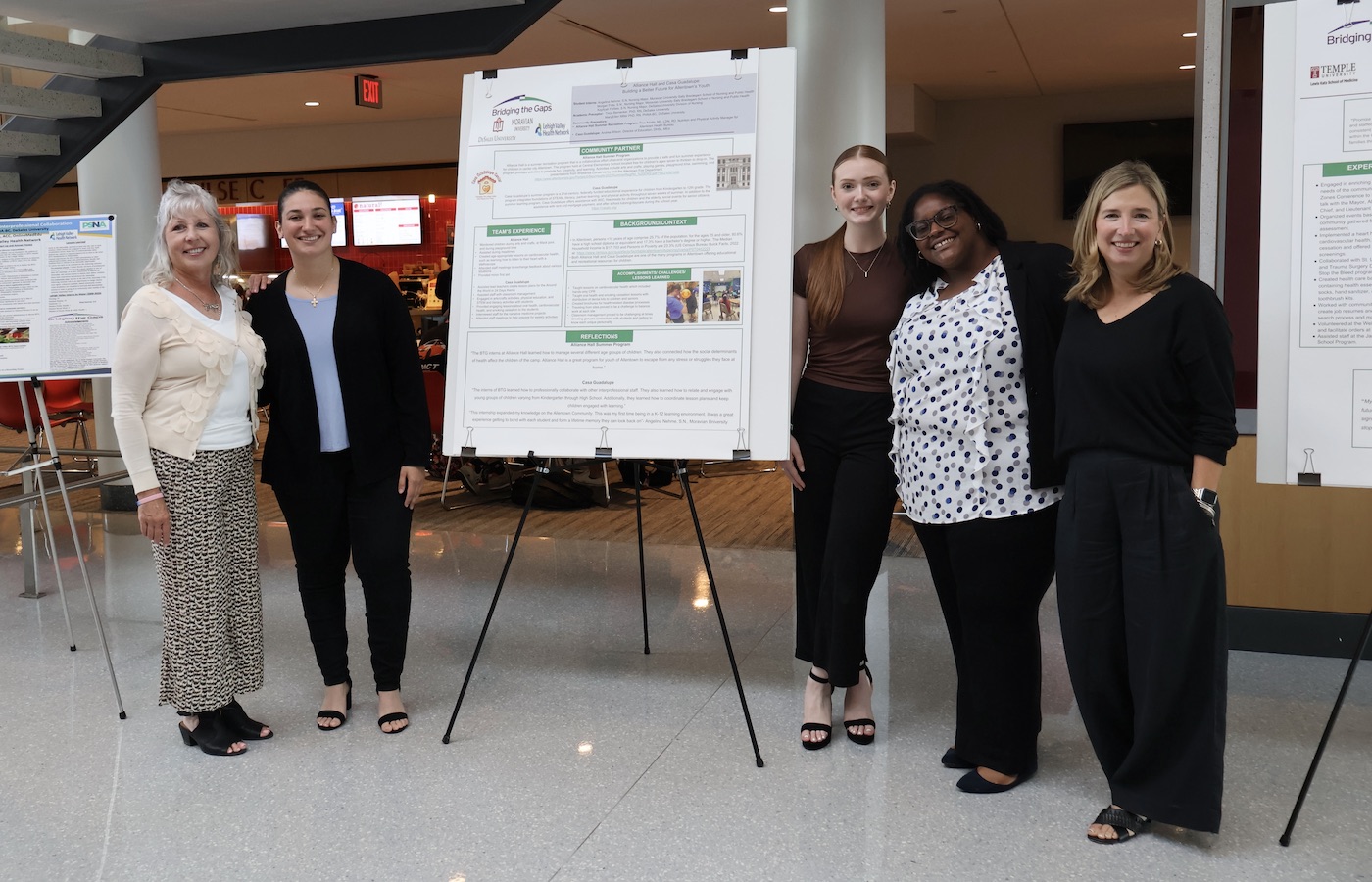 Students and faculty by Bridging the Gaps poster presentation