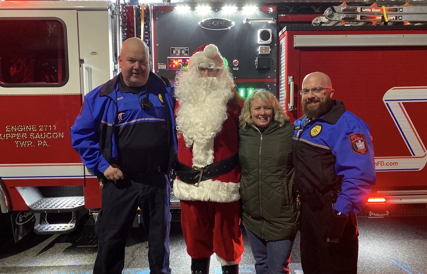 Jennifer Conner with DeSales police officers and Santa