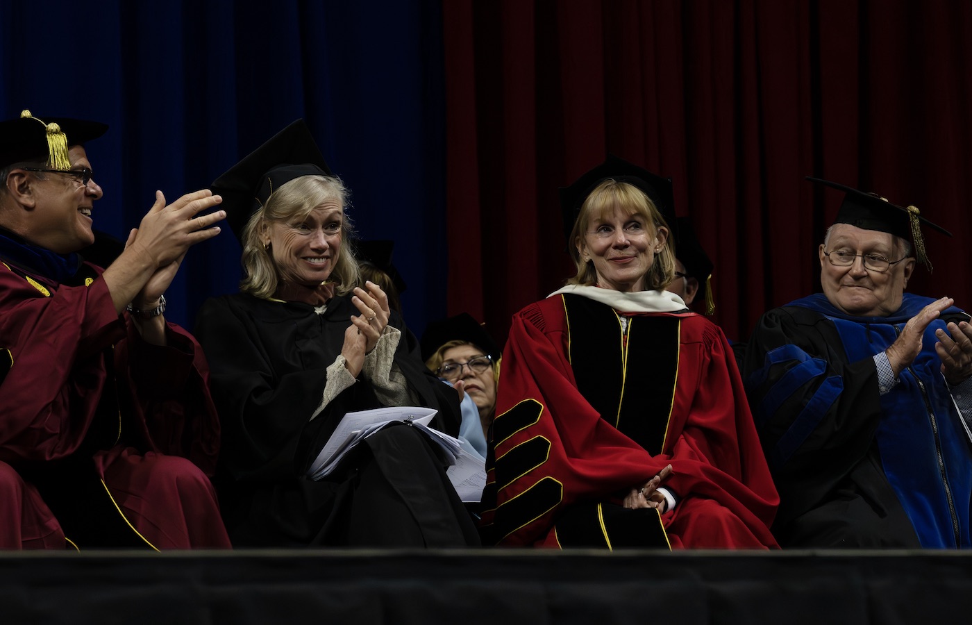 Father Kevin Nadolski, Anne Lewis, Katherine Ramsland, and Rodger Berg at Commencement