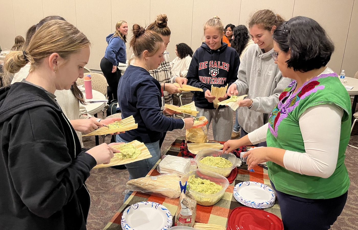 Students making tamales during Latin cooking class