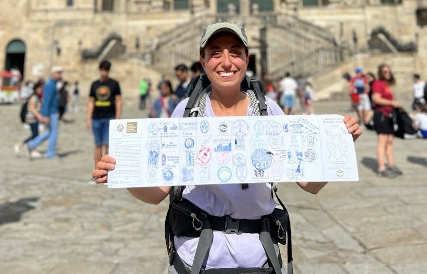 Michelle Khawam holding a map while on the Camino trail