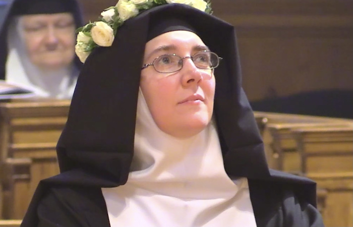 Sister Margaret Joseph Armstrong, VHM ’07, smiling in church 