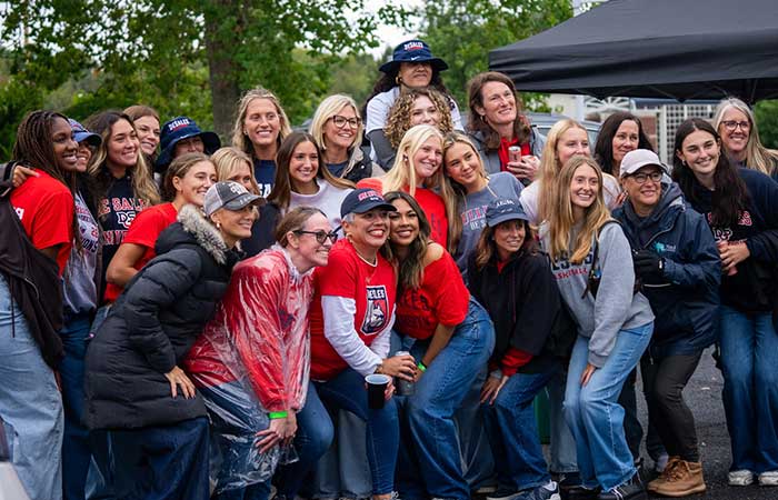 a group of DeSales alumni pose for a photo