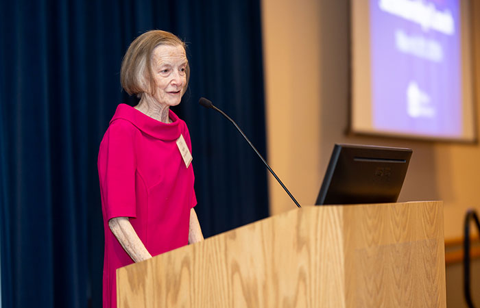 Regina Torsney-Durkin standing at a podium giving a speech